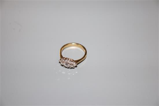 A modern 18ct gold and diamond cluster ring, size M, gross 3.2 grams.